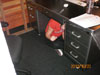 Michelle Cavin seeks cover under her desk during the drill at Cartoon Network Studios in Burbank.